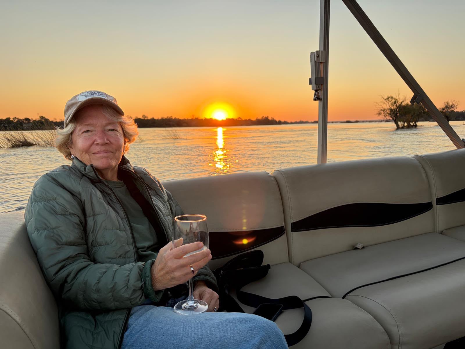 Safari Awecrafters traveler enjoying a sunset on the water
