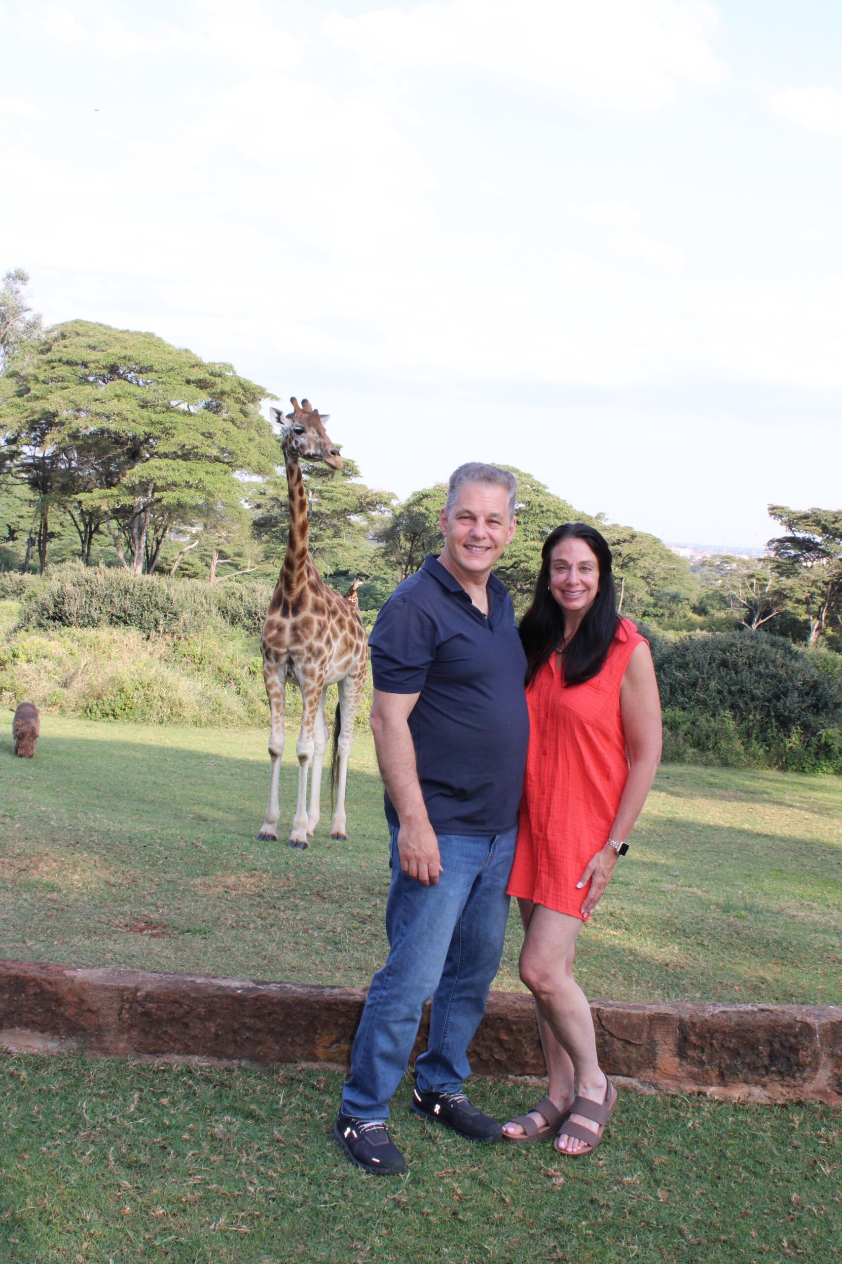 Safari Awecrafters travelers sharing a close giraffe encounter
